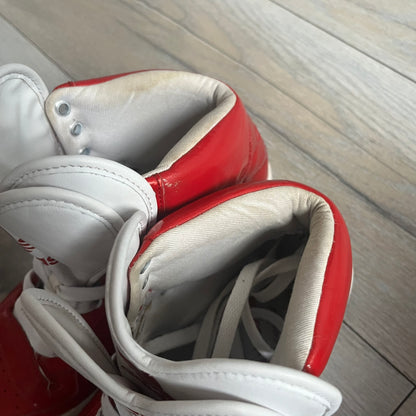 Adidas Originals Metro Attitude Logo Heart Sneakers are women’s sneakers released in 2012, featuring a red suede upper with matching University-Red accents. The design includes dual heart-shaped tongues in white with red Adidas logos, paired with a white sole and laces. Metro Attitude Logo Heart W model (G61014) inspired by Jeremy Scott collaborations.