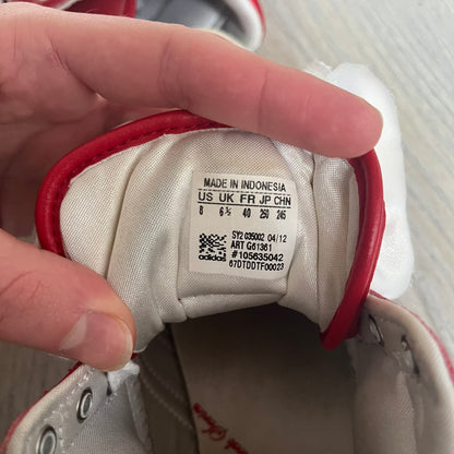 Adidas Originals Top Ten Hi Sleek Bow Sneakers are women’s high-top sneakers in University-Red and white leather. They feature a removable white bow on the tongue, white Adidas stripes, laces, and a white sole. Released under product number G61361, the sneakers include patent leather details for a polished finish.