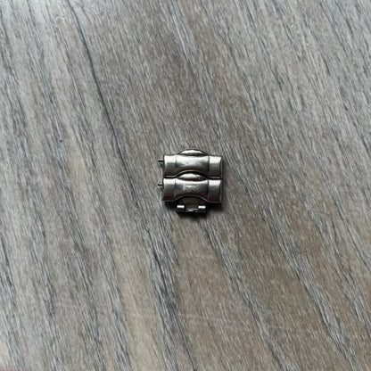 Adidas VS Chronograph 10-5010 Analog Watch is a silver-tone metal timepiece featuring a metallic blue dial with day and seconds indicators. The watch includes three sub-dials, a detailed seconds track, and three side buttons for chronograph functions. Designed with a sturdy, thick case, it comes with an extra link for adjustable sizing.