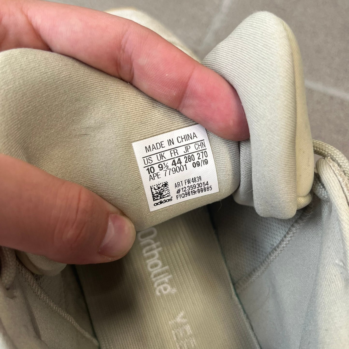 Adidas Yeezy 500 “Stone” Sneakers feature a Stone/Stone/Stone colorway with suede and neoprene paneling, reflective piping, and a pull-tab at the tongue. The sneakers have a lace-up fastening, adiPRENE midsole, and gum rubber outsole. Style FW4839, released November 23, 2019.
