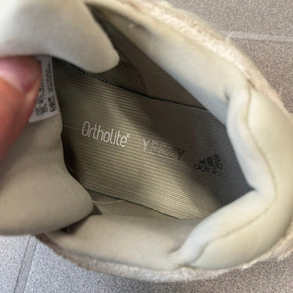 Adidas Yeezy 500 “Stone” Sneakers feature a Stone/Stone/Stone colorway with suede and neoprene paneling, reflective piping, and a pull-tab at the tongue. The sneakers have a lace-up fastening, adiPRENE midsole, and gum rubber outsole. Style FW4839, released November 23, 2019.
