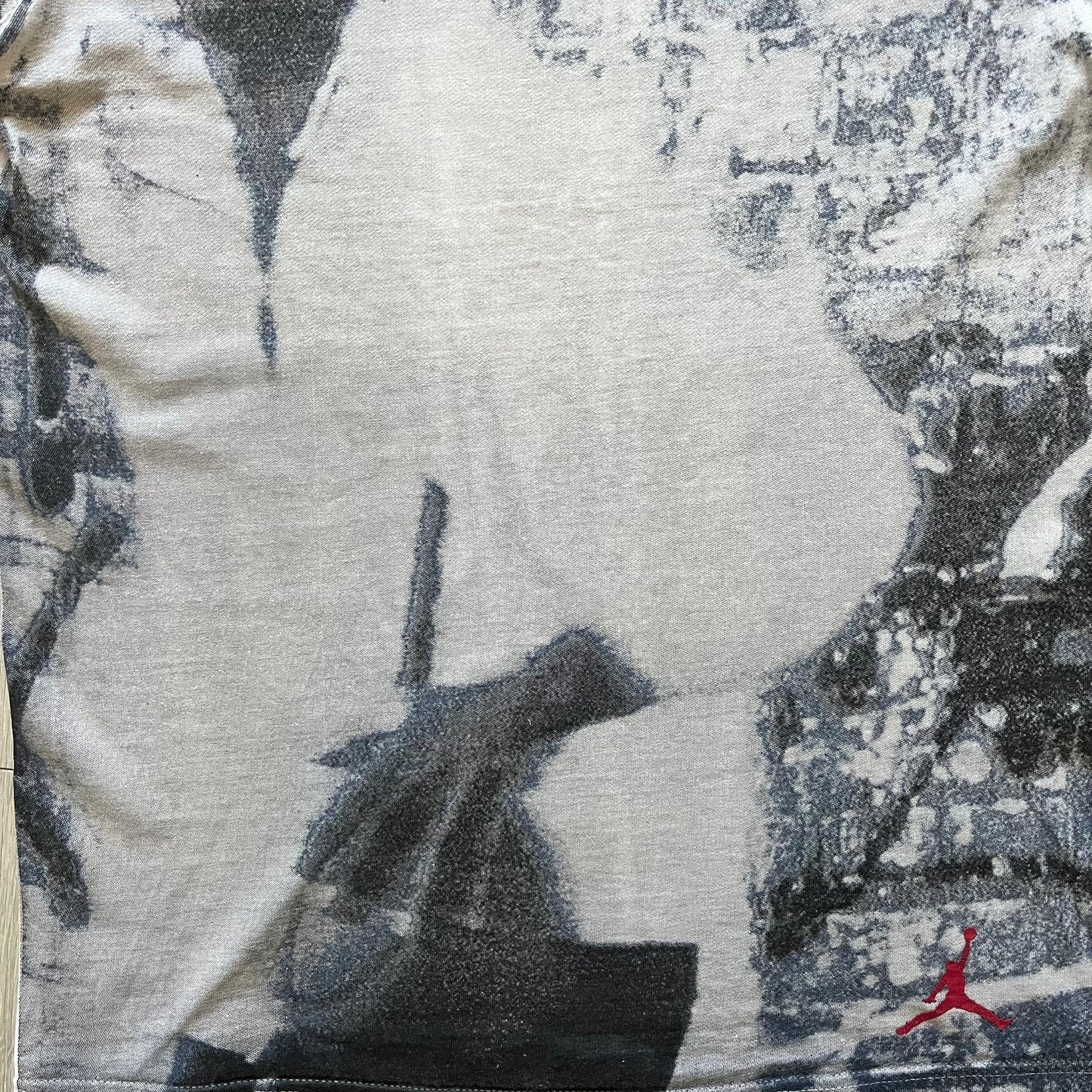 Air Jordan 2000’s All Over Print Tee featuring a bold full print of Michael Jordan in black, white, and blue across the front. A small red Jumpman logo sits at the bottom, while the back showcases a large Air Jordan logo with embroidered small red logo just under the collar. A rare vintage piece from the 2000s that captures peak Jordan era style.
