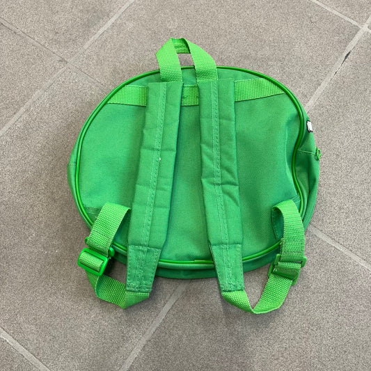 Angry Birds 2010s Bad Piggies Green Backpack is a small circular backpack shaped like the head of a Bad Piggies character. The front features the pig’s scared facial expression, while the side has an Angry Birds logo. The interior includes an all-over pig head monogram lining and an official Angry Birds licensed tag. The backpack is finished with really short adjustable shoulder straps.