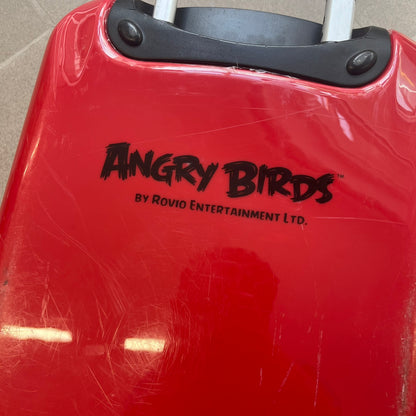 Angry Birds 2010s Red Bird Suitcase is a red rolling suitcase featuring the face of Red, the iconic Angry Birds character, on the front. It includes black wheels, a silver and black retractable handle, and an Angry Birds logo on the back. The interior features adjustable straps, zipped mesh compartments, and an all-over monogram lining with Angry Birds character patterns.