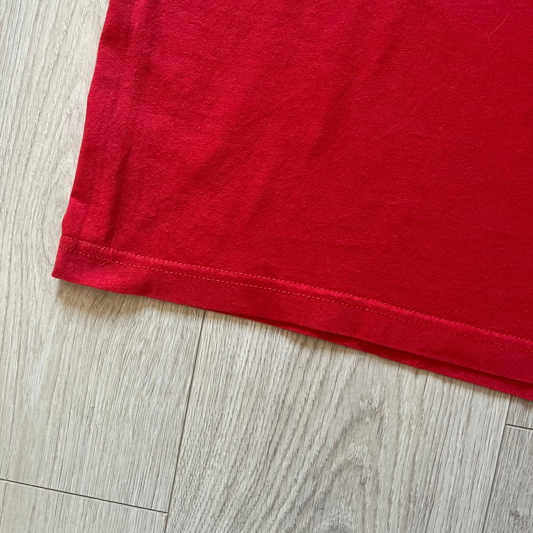 Red fabric on a wooden floor