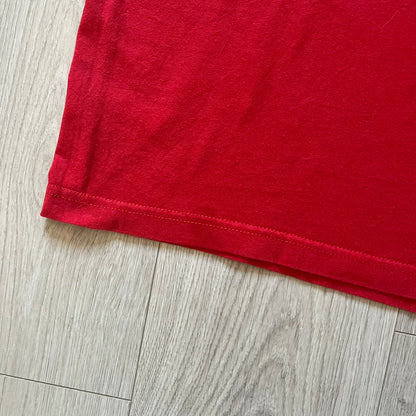 Red fabric on a wooden floor