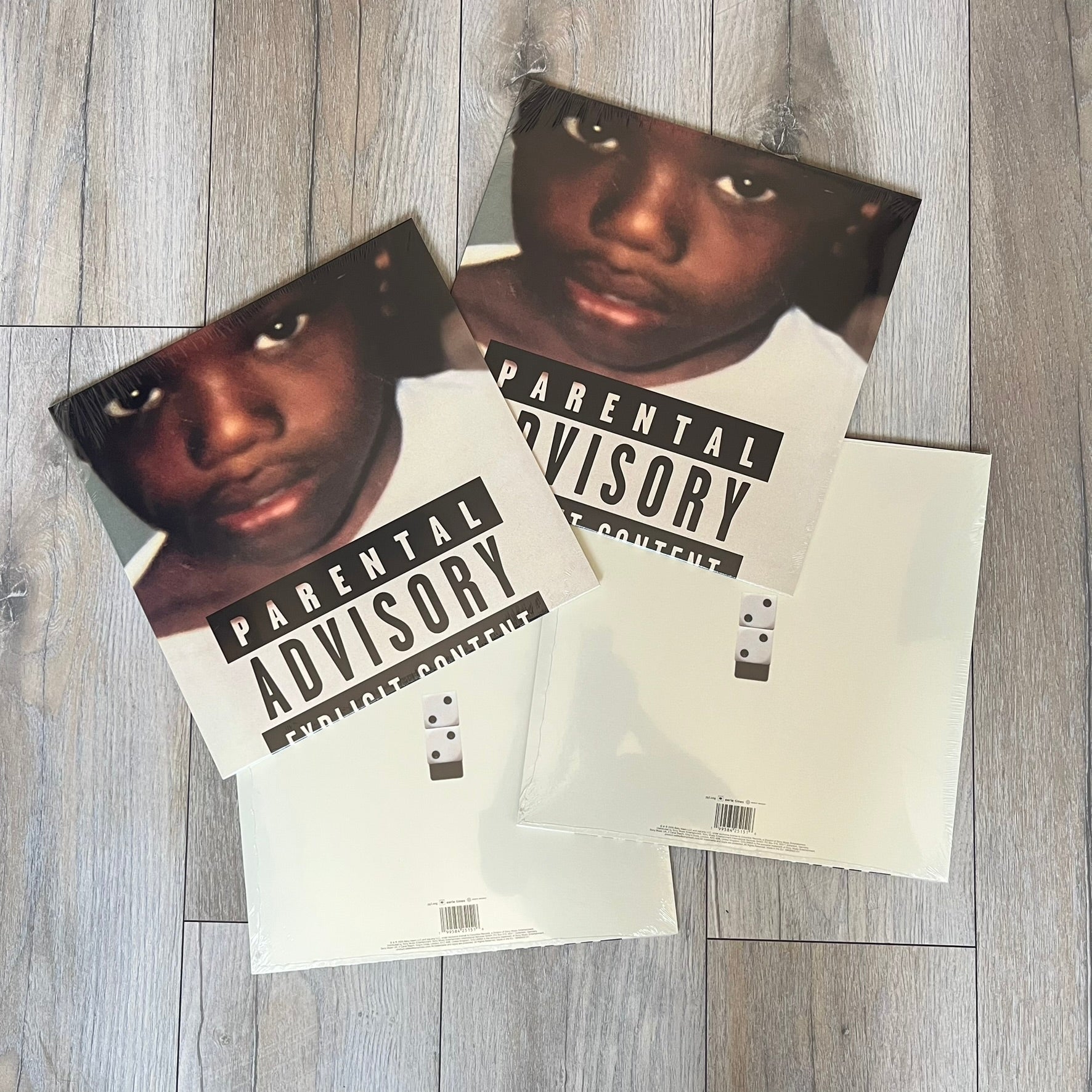 Baby Keem “Ca$ino” Exclusive Vinyl is a first print release from February 20, 2026, issued under pgLang (C-389572). The record includes an exclusive track “Tubi,” with additional audio differences such as extended talking on track A1 and an intro clip on track A5 not present on digital versions. The cover features Baby Keem on the front with a large “Parental Advisory” label, while the back displays two dice showing double twos.