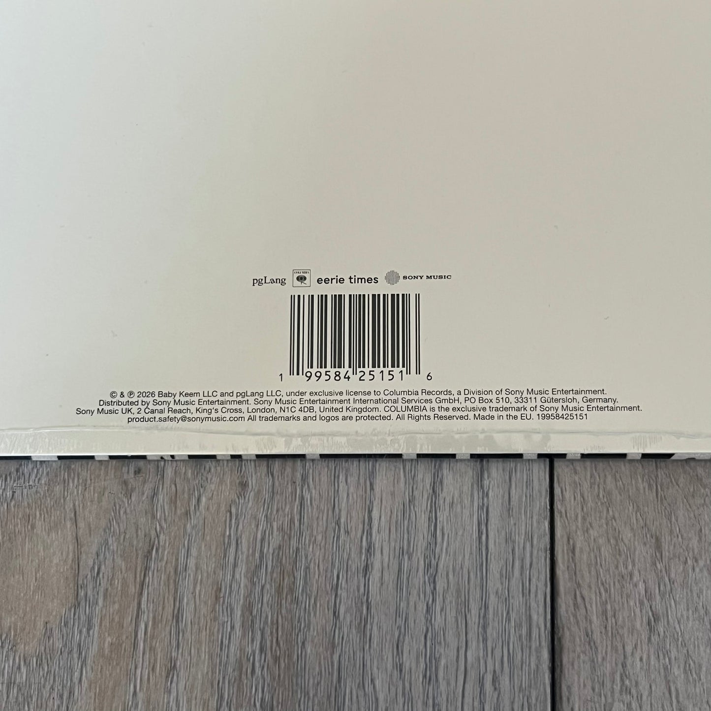 Baby Keem “Ca$ino” Exclusive Vinyl is a first print release from February 20, 2026, issued under pgLang (C-389572). The record includes an exclusive track “Tubi,” with additional audio differences such as extended talking on track A1 and an intro clip on track A5 not present on digital versions. The cover features Baby Keem on the front with a large “Parental Advisory” label, while the back displays two dice showing double twos.