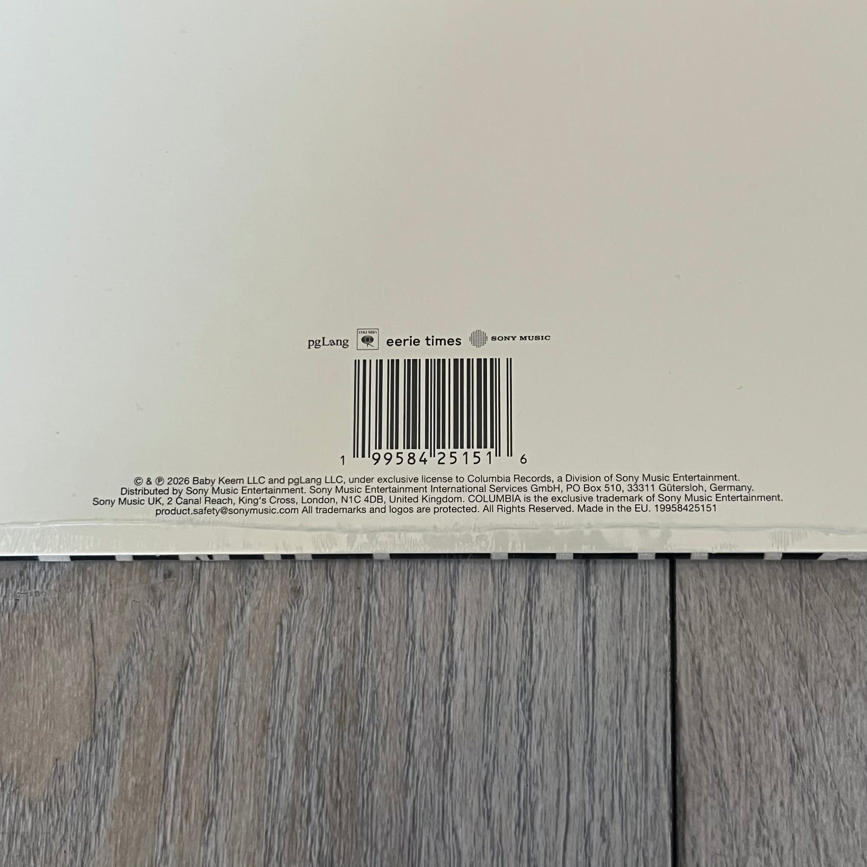 Baby Keem “Ca$ino” Exclusive Vinyl is a first print release from February 20, 2026, issued under pgLang (C-389572). The record includes an exclusive track “Tubi,” with additional audio differences such as extended talking on track A1 and an intro clip on track A5 not present on digital versions. The cover features Baby Keem on the front with a large “Parental Advisory” label, while the back displays two dice showing double twos.