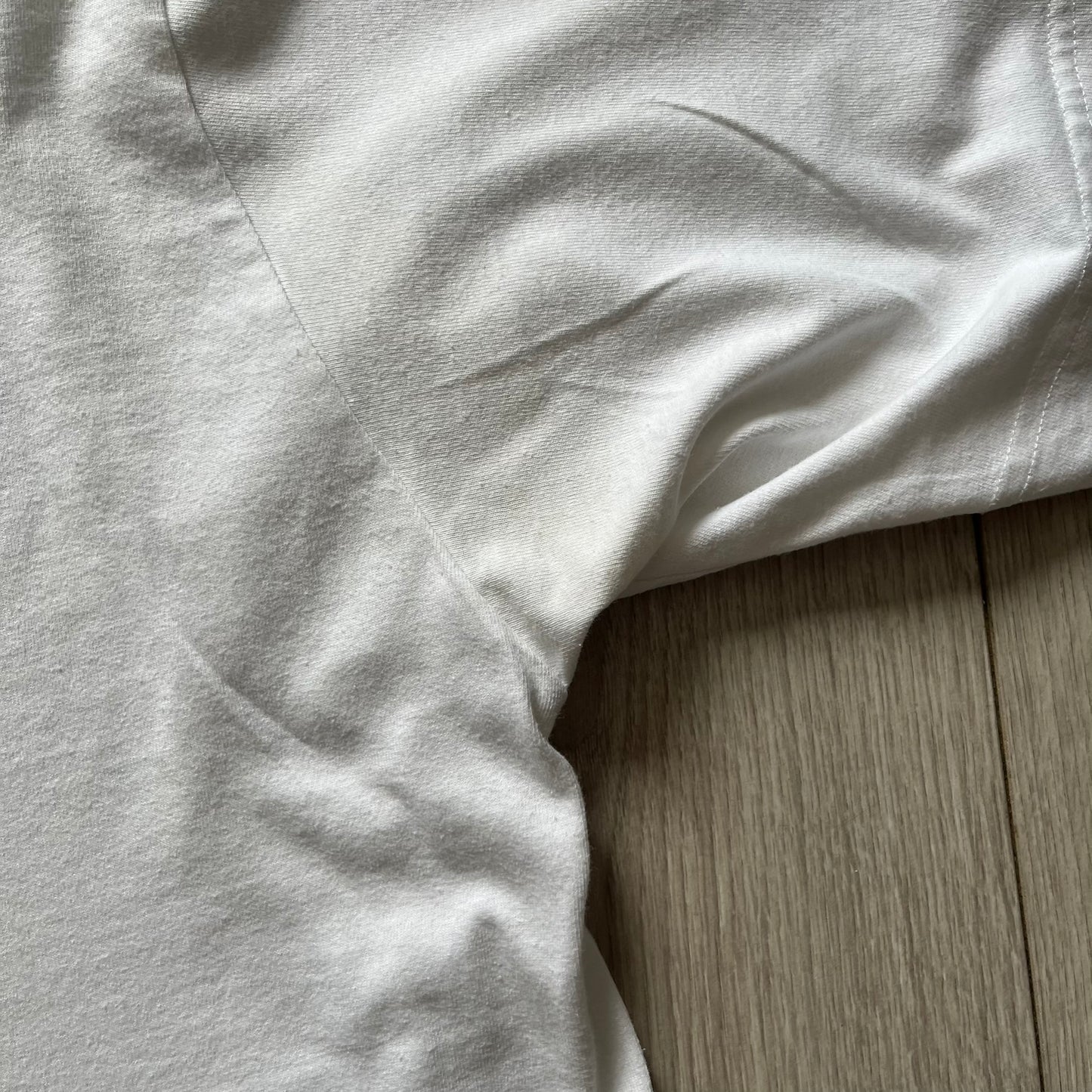 Balenciaga back logo tee from 2018, crafted in Portugal from soft white cotton. Designed with an oversized fit, it features a bold Balenciaga text logo across the upper back. Lower back part is a lot wider than front.