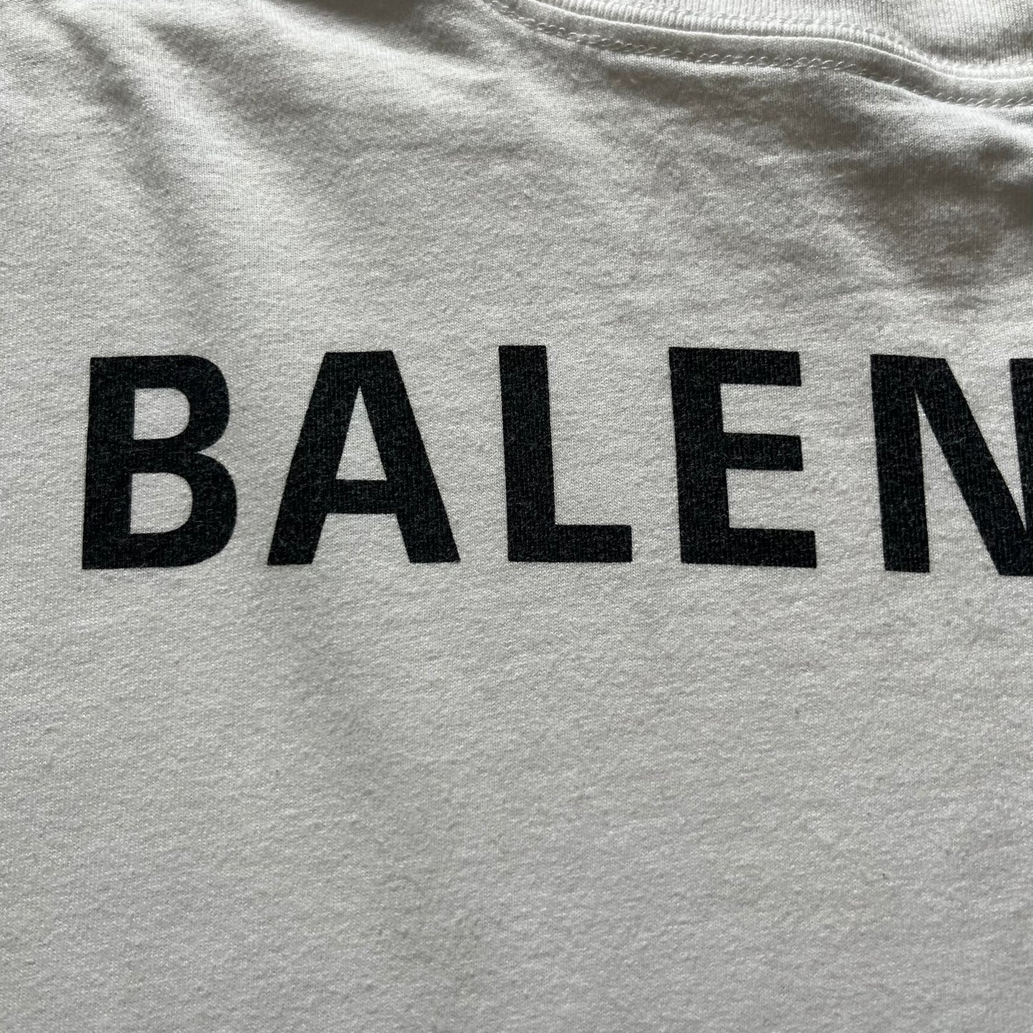 Balenciaga back logo tee from 2018, crafted in Portugal from soft white cotton. Designed with an oversized fit, it features a bold Balenciaga text logo across the upper back. Lower back part is a lot wider than front.