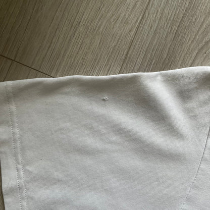 Balenciaga white copyright tee from the Autumn/Winter 2020 collection, crafted in Portugal from premium cotton. Featuring the house’s minimalist design, it’s finished with simple black “Balenciaga” text and a copyright logo on the chest. A clean and high-quality essential.