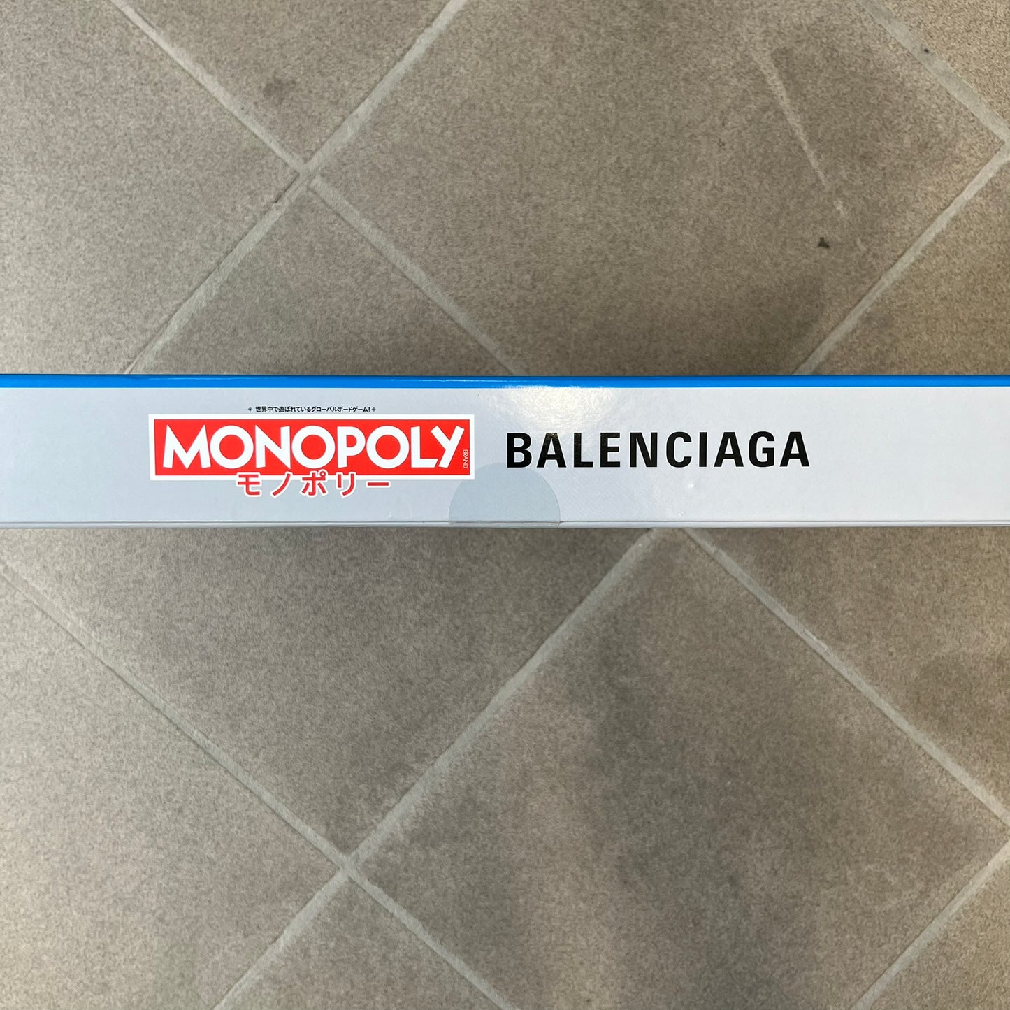Balenciaga Monopoly 2025 VIP Gift Board Game features a custom Monopoly design made for Balenciaga. The game includes gold-tone fashion-themed playing pieces such as scissors, a thimble, thread spool, and mannequin. The board replaces standard properties with Balenciaga stores and locations, while the currency and cards feature Balenciaga branding and custom references including “Balenciaga Tax.”
