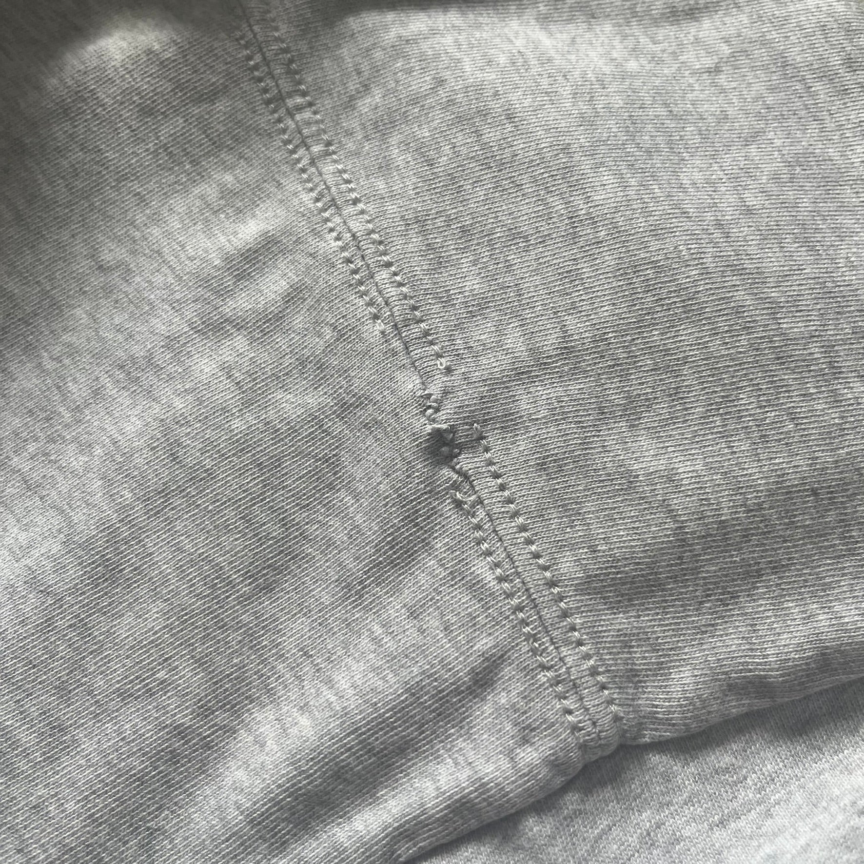 Close-up of a gray fabric with stitching detail