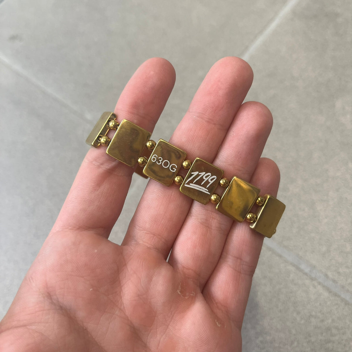 Bazo 1199 "63 OG" Stainless Steel Gold Plated Bracelet is a gold color stainless steel bracelet with thin and smooth beads. The interior is engraved with the 1199 logo and 63OG text.&nbsp;&nbsp;
