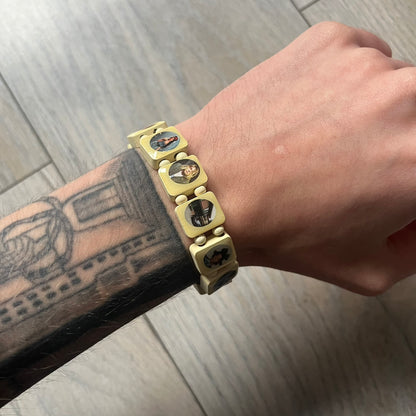 Pastel Yellow “Forever 27 Club” bracelet by Bazo 1199, showcasing painted wooden beads and engraved portraits of legendary artists from the infamous 27 Club like Kurt Cobain, Basquiat, and Fredo Santana. Signed “forever 27 club” and “1199” on the inside.
