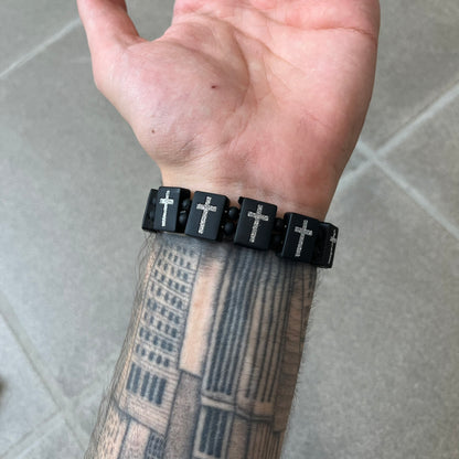 Bazo 1199 “God’s Lonely Kids” Bracelet is a black silicone bead bracelet featuring crystal cross details on the outside of each bead. The interior is engraved with the 1199 logo and “God’s Lonely Kids” text.