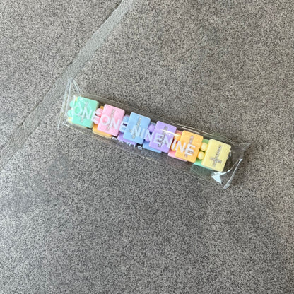 Bazo 1199 “God’s Lonely Kids” Bracelet is a multicolor silicone bead bracelet featuring crystal cross details on the outside of each bead. The interior is engraved with the 1199 logo and “God’s Lonely Kids” text.&nbsp;