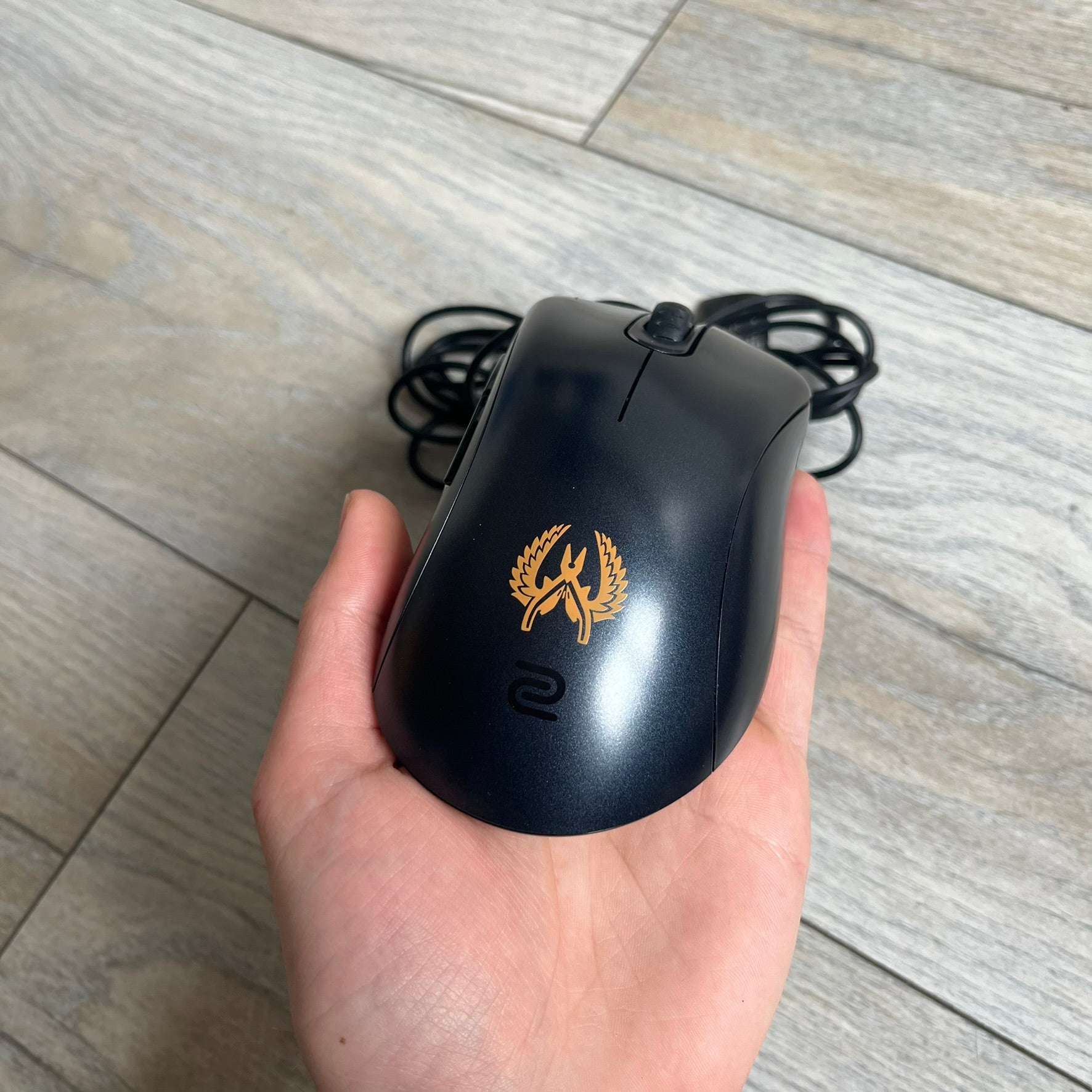 BenQ Zowie EC1-B CS:GO Special Edition Gaming Mouse is a wired ergonomic mouse designed for right-handed users, featuring a PixArt 3360 optical sensor with adjustable DPI settings. The black casing includes a CS:GO Guardian graphic, with a 1000 Hz polling rate, five buttons, and a scroll wheel for precise control. It has a USB connection, 2-meter cable, and a lightweight 94 g construction optimized for palm and claw grip styles.
