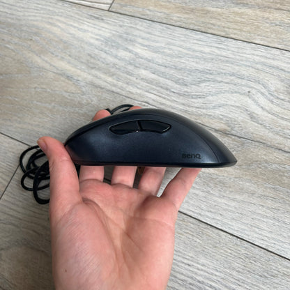 BenQ Zowie EC1-B CS:GO Special Edition Gaming Mouse is a wired ergonomic mouse designed for right-handed users, featuring a PixArt 3360 optical sensor with adjustable DPI settings. The black casing includes a CS:GO Guardian graphic, with a 1000 Hz polling rate, five buttons, and a scroll wheel for precise control. It has a USB connection, 2-meter cable, and a lightweight 94 g construction optimized for palm and claw grip styles.