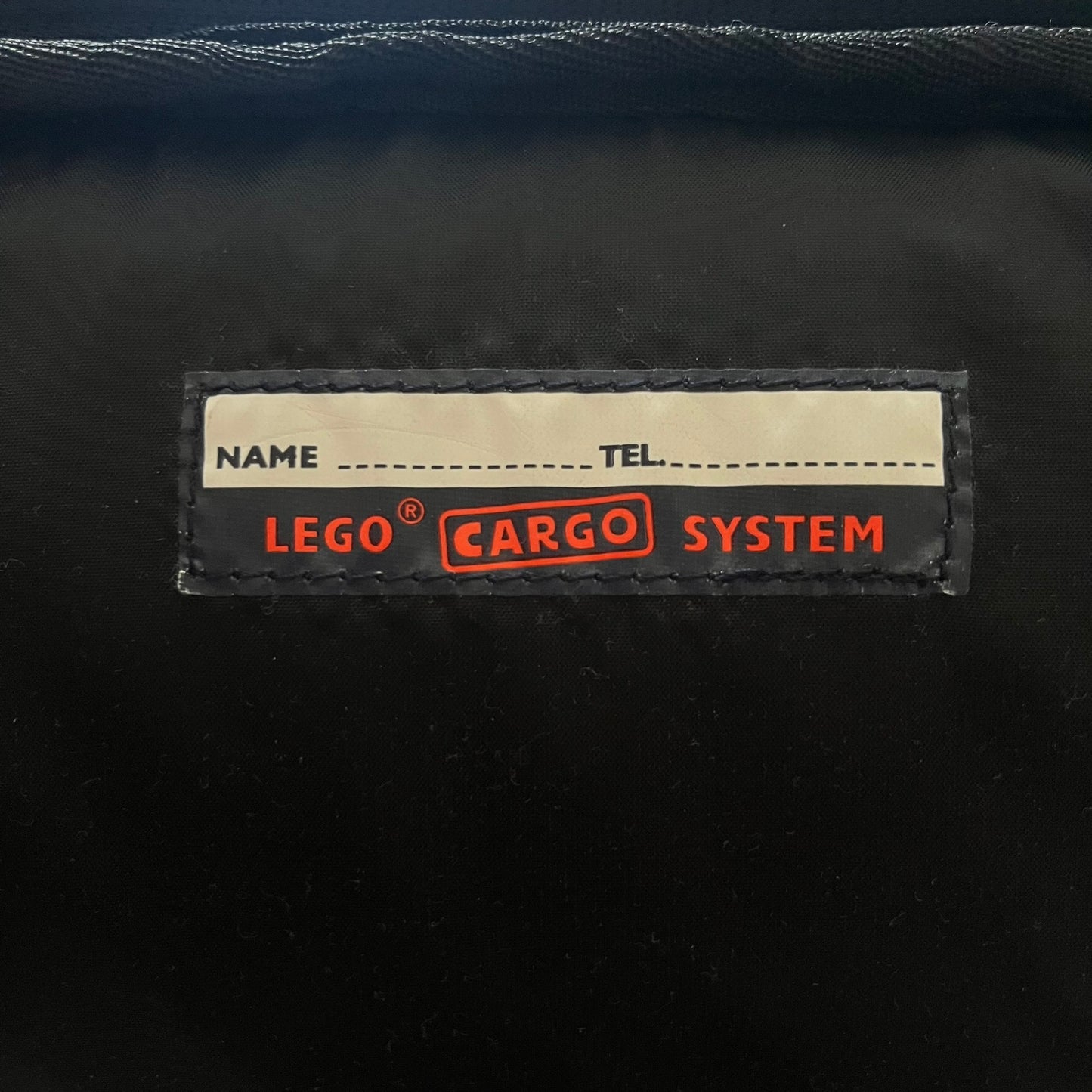  Extremely rare 2003 Bionicle Tahu Nuva backpack, produced by Kabooki for the Lego Cargo System line. The front features a large 3D molded face of Tahu Nuva, topped with a big Bionicle logo and his name underneath. Designed with one spacious main compartment and two smaller side pockets secured by velcro straps. Backpack was basically never seen online before.