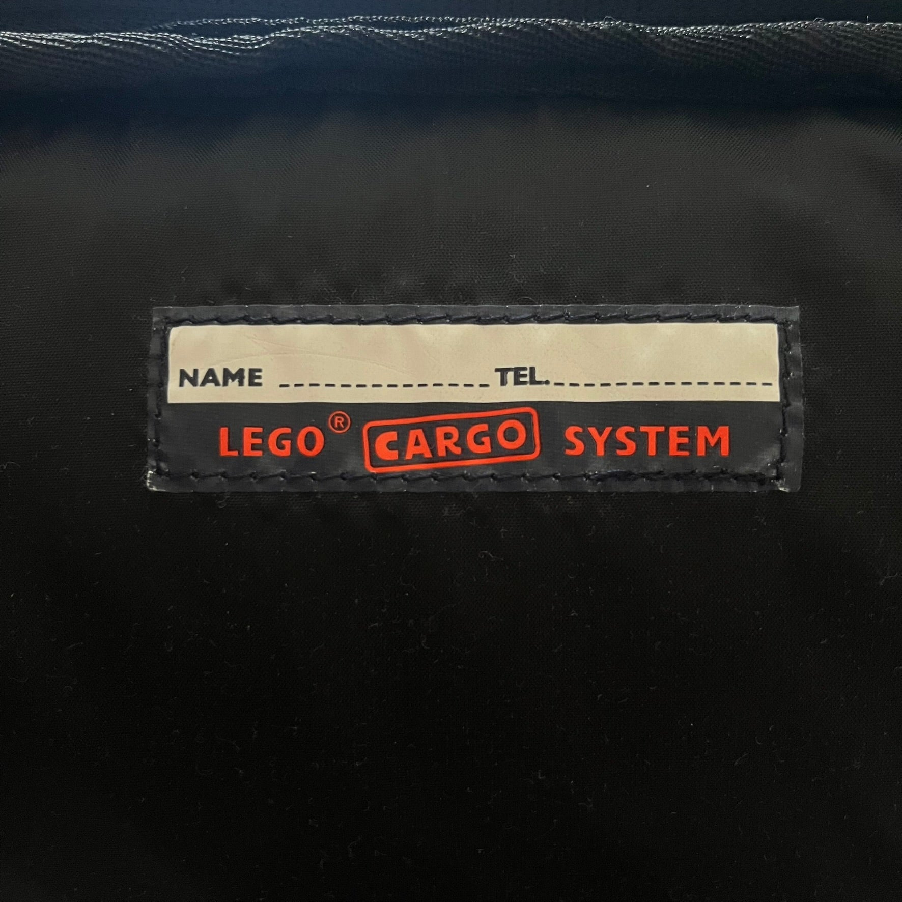  Extremely rare 2003 Bionicle Tahu Nuva backpack, produced by Kabooki for the Lego Cargo System line. The front features a large 3D molded face of Tahu Nuva, topped with a big Bionicle logo and his name underneath. Designed with one spacious main compartment and two smaller side pockets secured by velcro straps. Backpack was basically never seen online before.