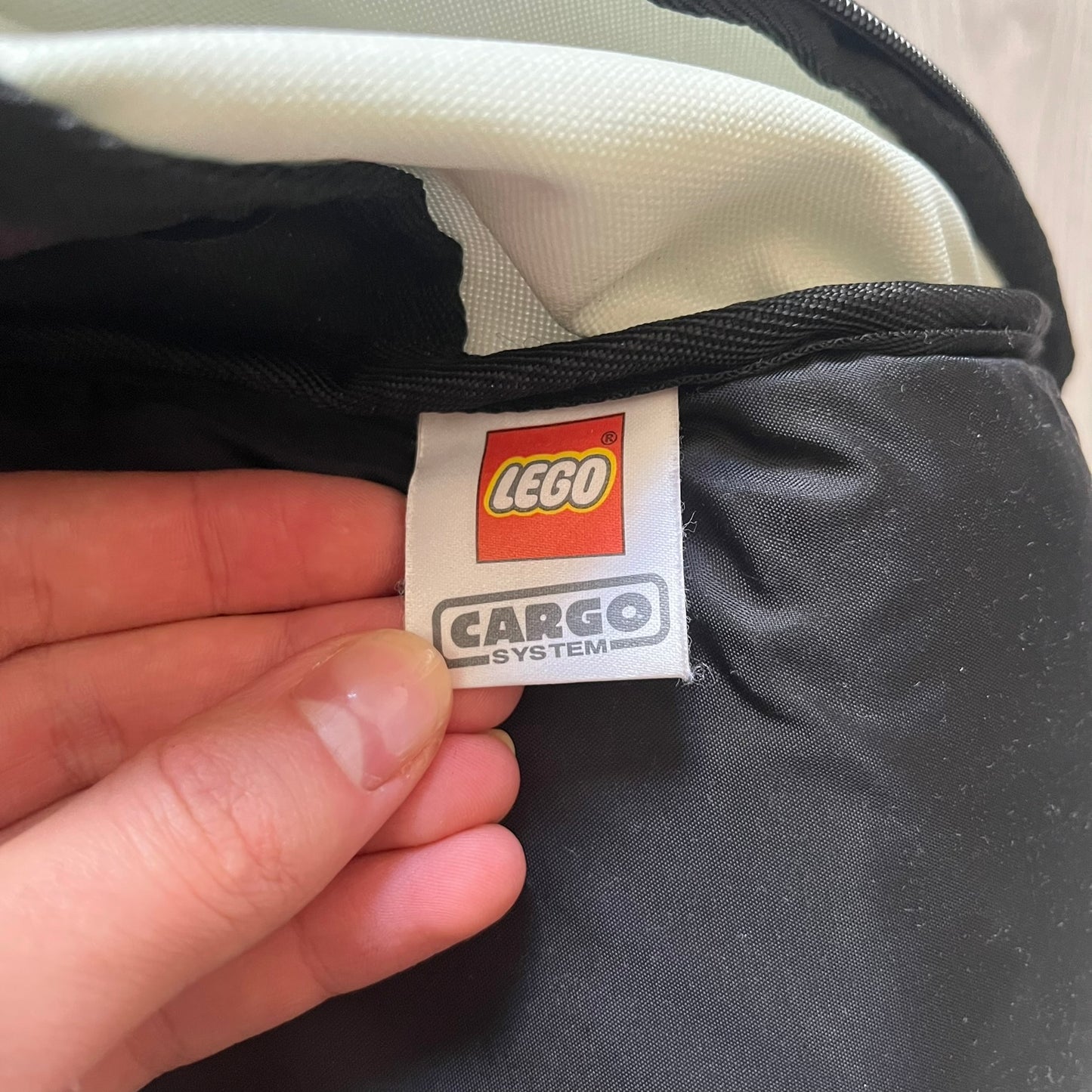  Extremely rare 2003 Bionicle Tahu Nuva backpack, produced by Kabooki for the Lego Cargo System line. The front features a large 3D molded face of Tahu Nuva, topped with a big Bionicle logo and his name underneath. Designed with one spacious main compartment and two smaller side pockets secured by velcro straps. Backpack was basically never seen online before.
