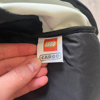  Extremely rare 2003 Bionicle Tahu Nuva backpack, produced by Kabooki for the Lego Cargo System line. The front features a large 3D molded face of Tahu Nuva, topped with a big Bionicle logo and his name underneath. Designed with one spacious main compartment and two smaller side pockets secured by velcro straps. Backpack was basically never seen online before.