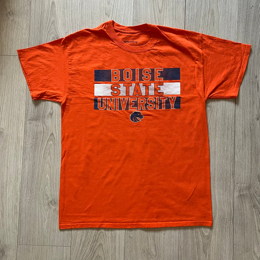 Orange t-shirt with 'Boise State University' text on a wooden floor