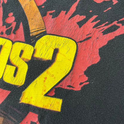 Borderlands 2 Promo 2010's Tee features a black boxy construction with a thick yellow and red Borderlands 2 logo printed on the front. A blood-splatter graphic appears behind the logo, and the shirt is made from 100% cotton.
