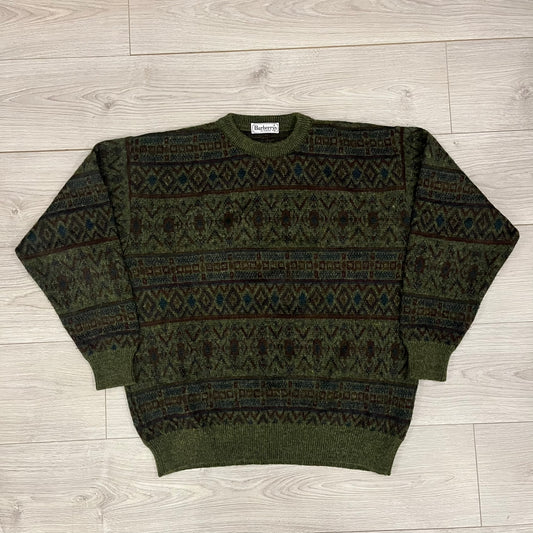 Burberry’s of London 90’s Sweater from 1998/99, crafted from a blend of acrylic, mohair, polyamide, wool, alpaca, and viscose. Features an all-over repeat pattern in green, navy, and brown tones. Vintage piece with original white Burberry tag.