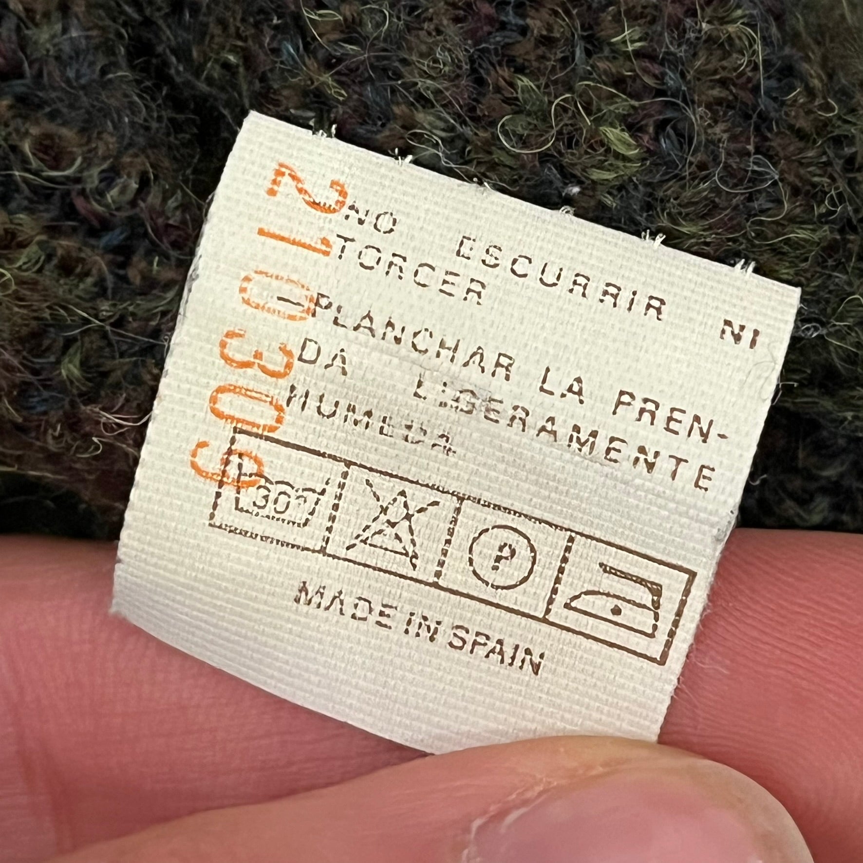 Burberry’s of London 90’s Sweater from 1998/99, crafted from a blend of acrylic, mohair, polyamide, wool, alpaca, and viscose. Features an all-over repeat pattern in green, navy, and brown tones. Vintage piece with original white Burberry tag.