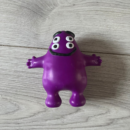 Official CPFM x McDonald’s Grimace collectible from the FW22 drop. The purple figure showcases the McDonald’s icon reimagined with CPFM’s four-eye design. Released October 3rd, 2022, as part of the limited adult Happy Meal collection, licensed on the back.