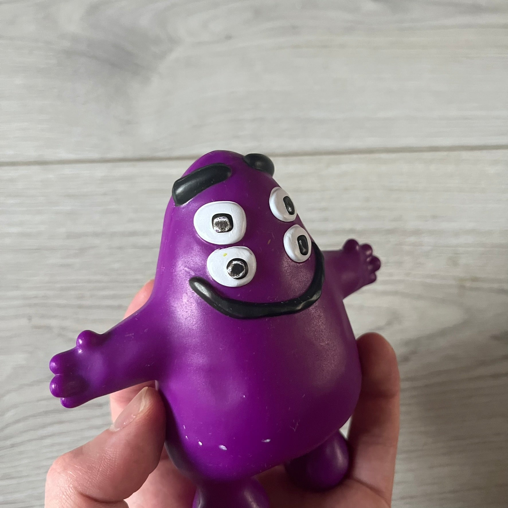 Official CPFM x McDonald’s Grimace collectible from the FW22 drop. The purple figure showcases the McDonald’s icon reimagined with CPFM’s four-eye design. Released October 3rd, 2022, as part of the limited adult Happy Meal collection, licensed on the back.