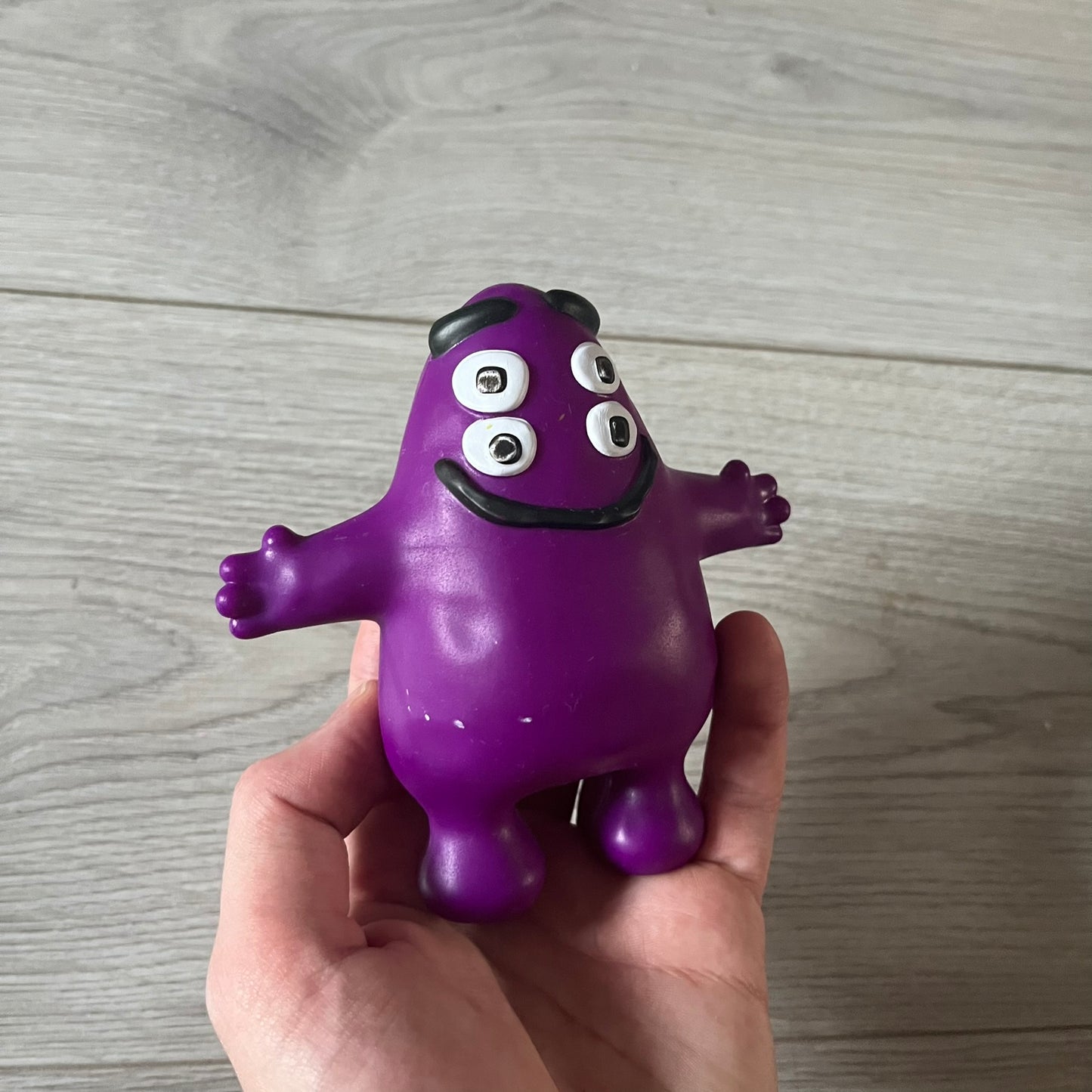Official CPFM x McDonald’s Grimace collectible from the FW22 drop. The purple figure showcases the McDonald’s icon reimagined with CPFM’s four-eye design. Released October 3rd, 2022, as part of the limited adult Happy Meal collection, licensed on the back.