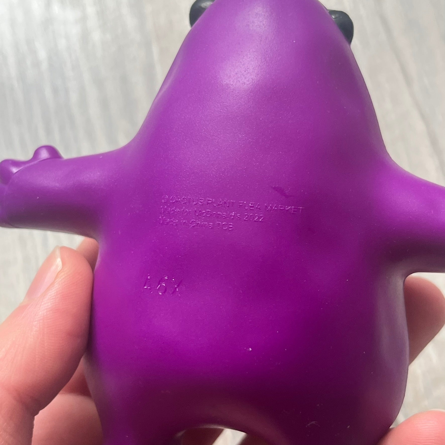 Official CPFM x McDonald’s Grimace collectible from the FW22 drop. The purple figure showcases the McDonald’s icon reimagined with CPFM’s four-eye design. Released October 3rd, 2022, as part of the limited adult Happy Meal collection, licensed on the back.