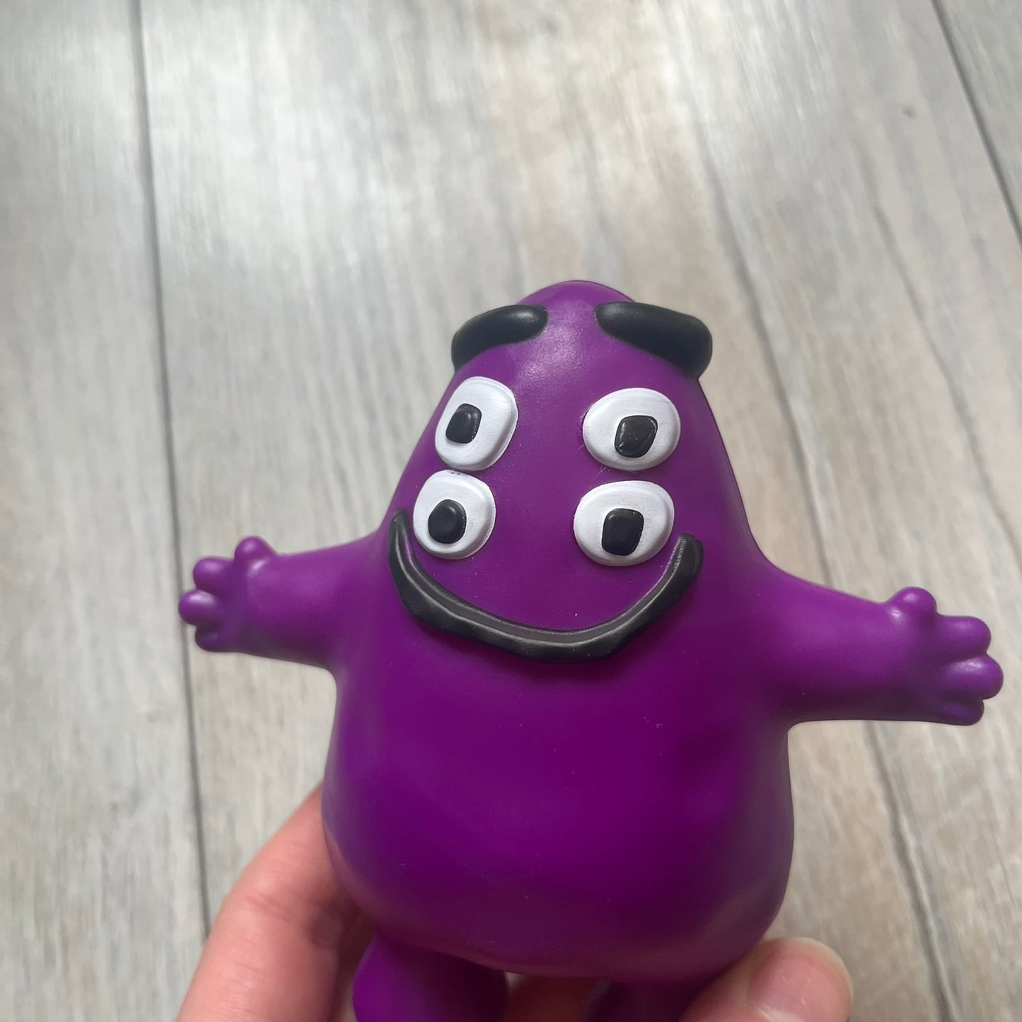 Official CPFM x McDonald’s Grimace collectible from the FW22 drop. The purple figure showcases the McDonald’s icon reimagined with CPFM’s four-eye design. Released October 3rd, 2022, as part of the limited adult Happy Meal collection, licensed on the back.