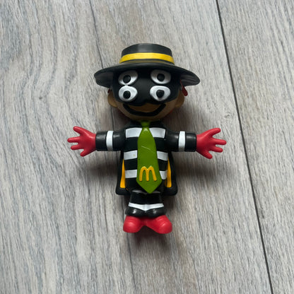 The CPFM x McDonald’s Hamburglar Figure from the FW22 adult Happy Meal drop features the classic character in his striped outfit, red gloves, and green McDonald’s tie, reimagined with CPFM’s four-eye design. Licensed on the back and released October 3rd, 2022.