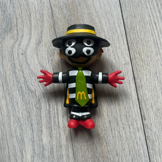 The CPFM x McDonald’s Hamburglar Figure from the FW22 adult Happy Meal drop features the classic character in his striped outfit, red gloves, and green McDonald’s tie, reimagined with CPFM’s four-eye design. Licensed on the back and released October 3rd, 2022.