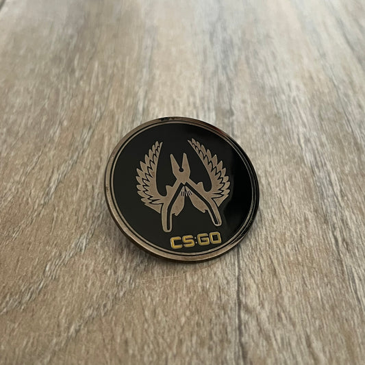 Original physical Counter-Strike: Global Offensive Series 1 Elite Guardian pin, produced as official Valve merchandise. These pins were sold at Valve-sponsored CS:GO Major events and later through the official WeLoveFine store, and originally included a code to unlock a “Genuine” in-game digital pin on a Steam profile. This example comes without the packaging and the in-game code.