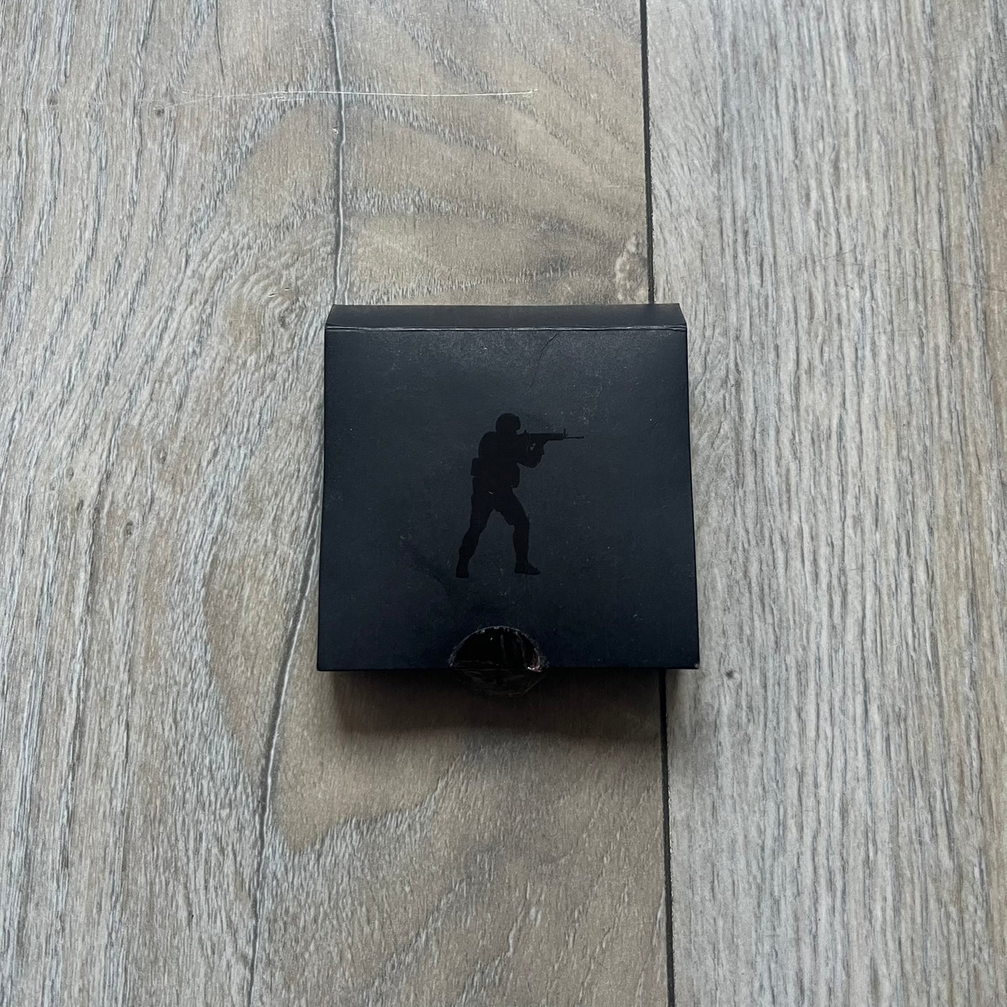 Original physical Counter-Strike: Global Offensive Series 1 Guardian pin, produced as official Valve merchandise. These pins were sold at Valve-sponsored CS:GO Major events and later through the official WeLoveFine store, and originally included a code to unlock a “Genuine” in-game digital pin on a Steam profile. This example comes complete with the original packaging; the code has been scratched and is already used.