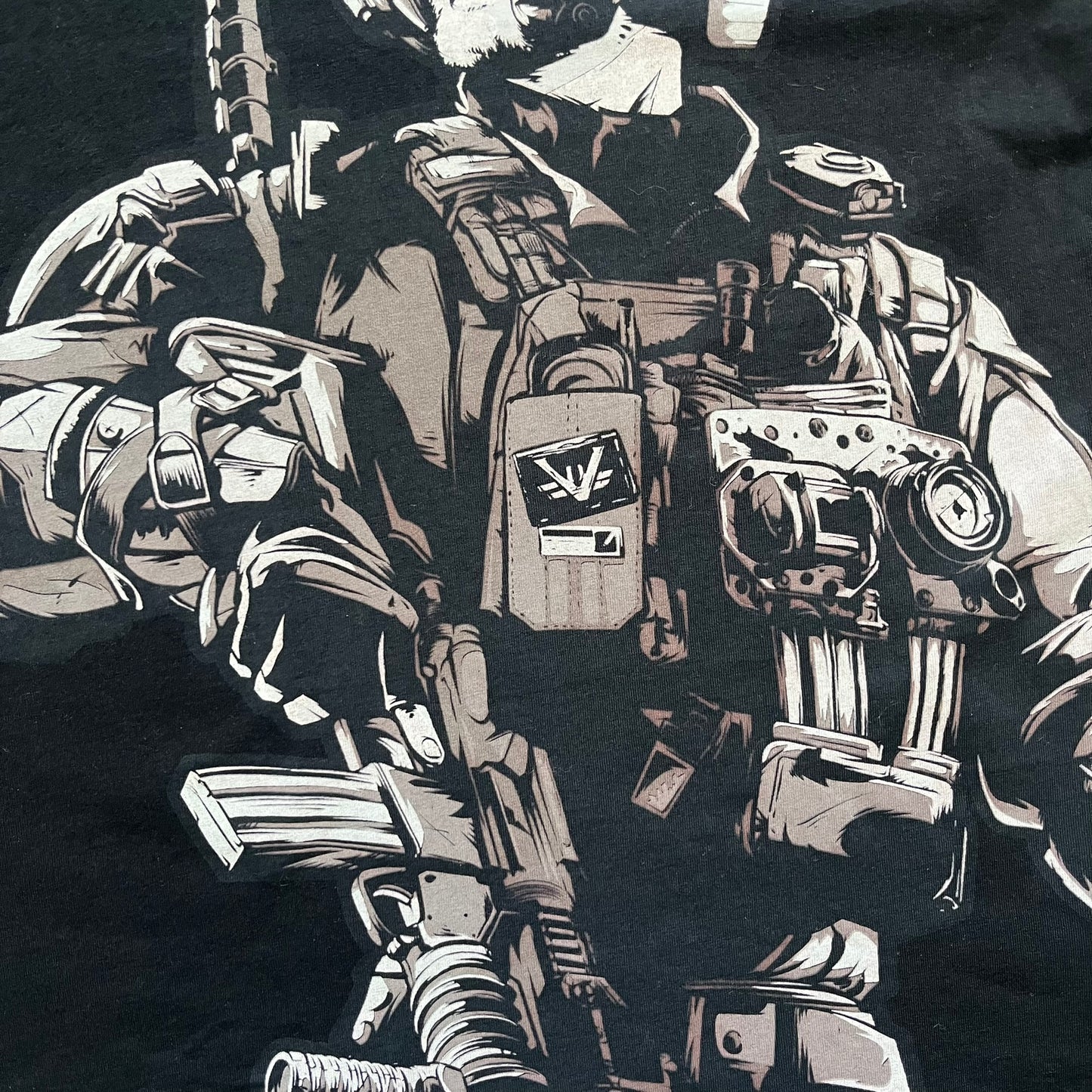 Call of Duty: Black Ops 2018 Black Tee is a black promotional T-shirt with a 2018 Activision Publishing licensed neck tag. The front features a large white and grey character graphic in armor holding a weapon, with the “Call of Duty Black Ops” logo printed above. The print spans most of the front from top to bottom.
