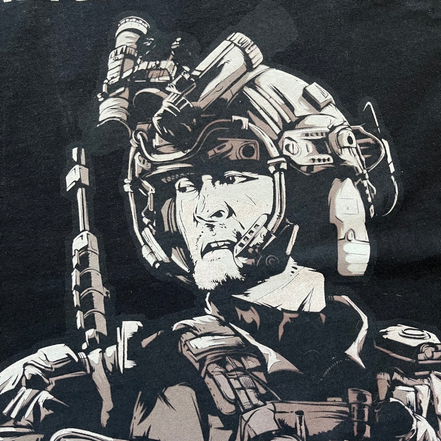 Call of Duty: Black Ops 2018 Black Tee is a black promotional T-shirt with a 2018 Activision Publishing licensed neck tag. The front features a large white and grey character graphic in armor holding a weapon, with the “Call of Duty Black Ops” logo printed above. The print spans most of the front from top to bottom.
