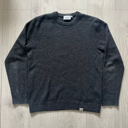  The Carhartt WIP Allen Sweater blends function and refinement in a dark gray wool–nylon knit. Midweight with ribbed details at the neck, cuffs, and hem, it ensures warmth and flexibility. A classic, durable knit that captures the minimal craftsmanship of Carhartt WIP.