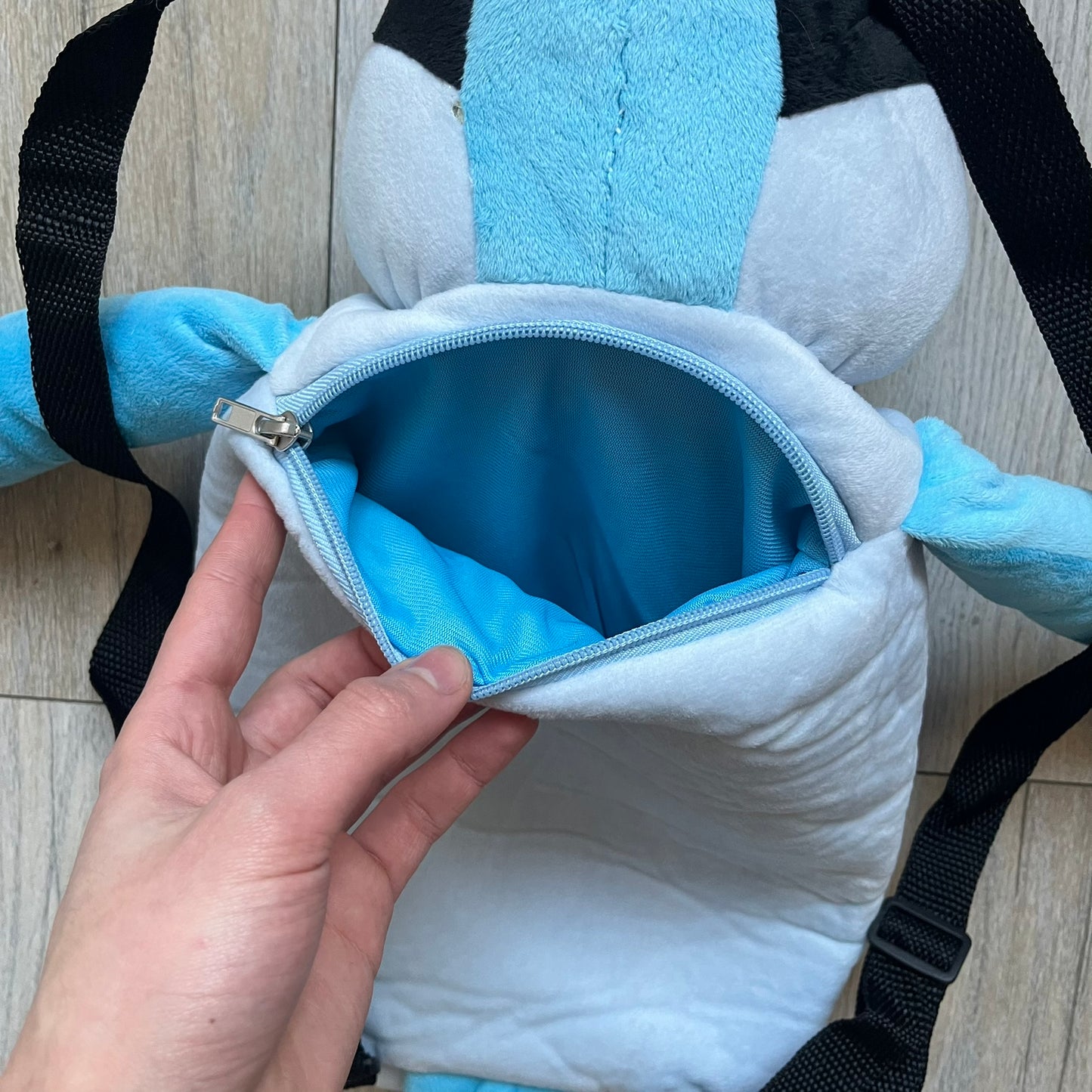 Cartoon Network Regular Show Mordecai 2016 Backpack is a full-body backpack featuring Mordecai with movable arms and legs. The straps attach from top to bottom, and the design shows his blue and light blue coloring, black head markings, striped wings, and tail feathers. The backpack replicates Mordecai’s animated appearance, including his crested head feathers and grey striped legs.