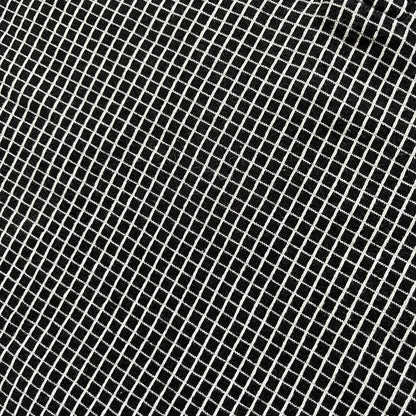 Cartoon Network Scooby-Doo 1999 Golf Polo is a black polo shirt featuring a grid pattern of thin white lines forming small squares across the fabric. The left chest displays an embroidered graphic of Scooby-Doo in a golf outfit digging in sand. The neck tag includes Warner Bros. and Cartoon Network 1999 licensing.