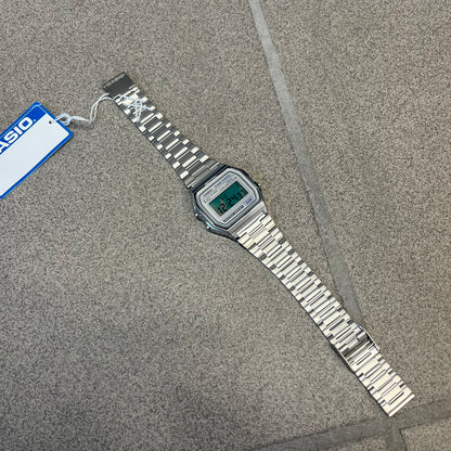 Custom Casio A158 "Chrome" Silver Digital Watch (A158WEA-7EF) is a custom Casio digital watch with a reflective silver filter over the square resin glass screen and a stainless steel band with an adjustable clasp, compatible with wrist sizes from 150 to 205 mm. It has a 1/100-second stopwatch, a daily alarm, an hourly time signal, an auto-calendar, a 12/24-hour format, a green LED light, and water resistance.