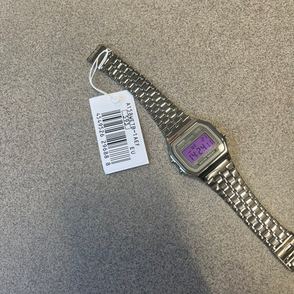 Custom Casio A158 "Royal Purple" Black &amp; Purple Digital Watch is a watch with a purple filter over the square screen and a grey ion-plated stainless steel band with an adjustable clasp. The case comes with a resin glass and a resin and black chrome-plated case and bezel. It has a 1/100-second stopwatch, a daily alarm, an hourly time signal, an auto-calendar, a 12/24-hour format, a green LED light, and water resistance.