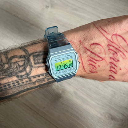Custom Casio F-91W Blue digital watch featuring a Gradient Blue and green filter screen. Slim 8.5 mm profile, lightweight 21 g build and flexible bio-based resin band ensure lasting comfort. Includes alarm, stopwatch, and microlight function for everyday functionality.