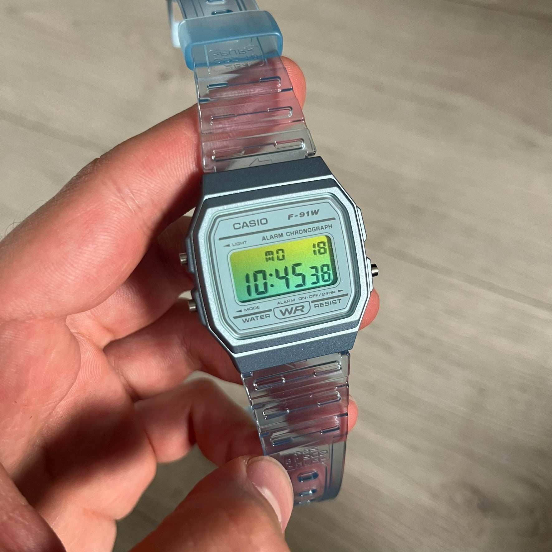 Custom Casio F-91W Blue digital watch featuring a Gradient Blue and green filter screen. Slim 8.5 mm profile, lightweight 21 g build and flexible bio-based resin band ensure lasting comfort. Includes alarm, stopwatch, and microlight function for everyday functionality.